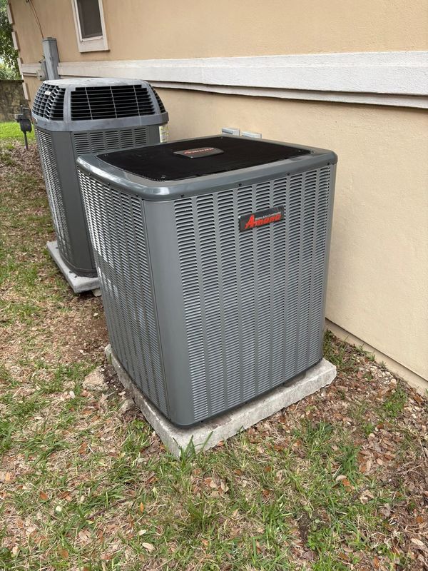 Outdoor residential air-conditioning condensers installed by Paradice Air Conditioning in San Antonio, Texas.