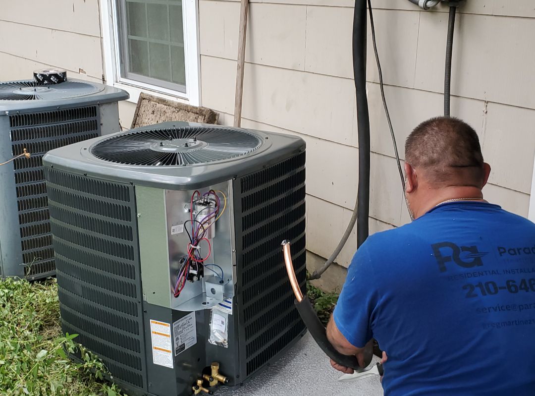 Paradice Air Conditioning technician installing AC system in San Antonio